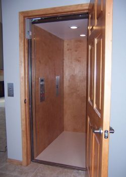 Home Elevator with birch interior and stainless steel trim