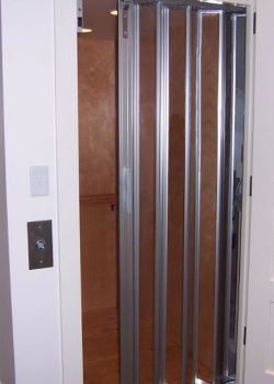 Home Elevator with maple interior and All Clear Acrylic gate panels