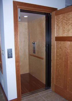 Home Elevator with maple interior and cherry floor