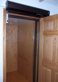 Home Elevator with oak interior and power doors