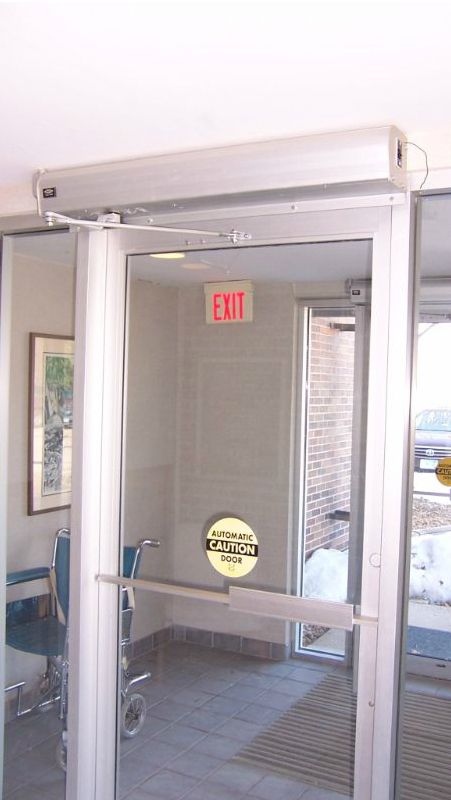 Synchronized commercial door operators in vestibule
