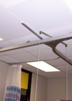 Ceiling track lift system - switch track in public school classroom