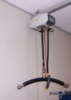 Ceiling track lift - lifter unit at charge station - school