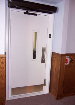 Entrance door with power operator to a commercial wheelchair lift - church