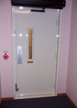 Wheelchair lift with fire-rated door